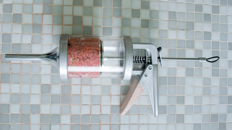 Illustration for article titled This Sausage Gun Fires Mouthwatering Ammo